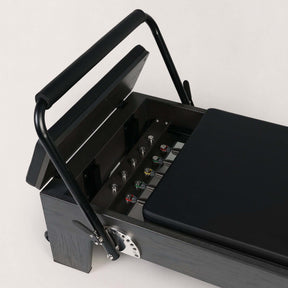 FOLD STUDIO Reformer with premium hardwood and plush upholstery, ideal for home and commercial use.