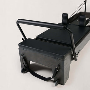 FOLD STUDIO Reformer close-up view, showcasing premium hardwood construction and sleek design.