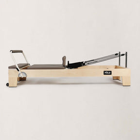 FOLD STUDIO Reformer machine featuring premium hardwoods and vegan-friendly upholstery.