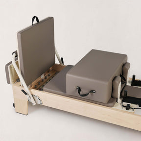 FOLD STUDIO Reformer showing premium hardwood structure and vegan-friendly upholstery.