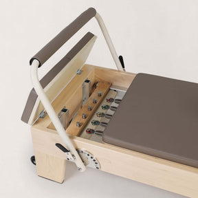 FOLD STUDIO Reformer machine featuring premium hardwood construction and vegan upholstery.