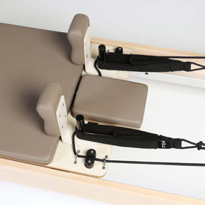 FOLD STUDIO Reformer with premium vegan upholstery and hardwood design for home or studio use.
