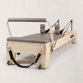 FOLD STUDIO Reformer machine with hardwood frame and vegan-friendly upholstery, designed for home or studio use.