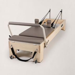FOLD STUDIO Reformer machine with premium hardwood and vegan upholstery for home use or studio.