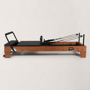 FOLD STUDIO Reformer machine with premium hardwood frame and vegan upholstery, ideal for home or studio use.