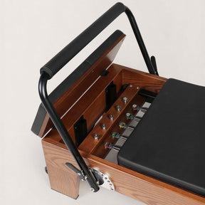 FOLD STUDIO Reformer close-up view showcasing premium hardwood and vegan-friendly upholstery details.