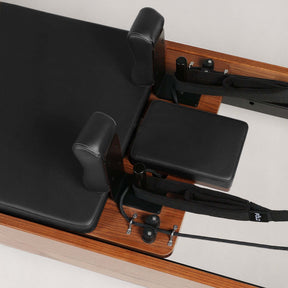 FOLD STUDIO Reformer machine detailing premium hardwood and vegan-friendly upholstery