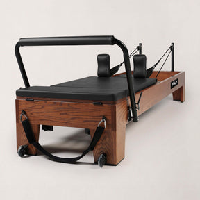 FOLD STUDIO Reformer machine with premium hardwood design and vegan upholstery for home or commercial use.