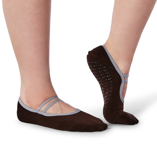 Brown socks with thin straps worn by a person on a white background