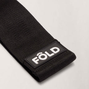 Pilates Resistance Band - Black Heavy with durable texture and logo detail for effective workouts.
