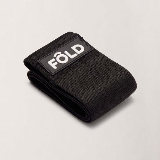 Pilates Resistance Band - Black Heavy folded with FÔLD branding for advanced strength training.