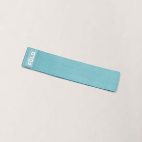 Pilates Resistance Band - Baby Blue Medium, a medium resistance band for enhancing Pilates workouts.