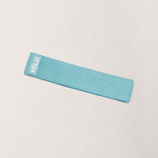 Pilates Resistance Band - Baby Blue Medium, a medium resistance band for enhancing Pilates workouts.