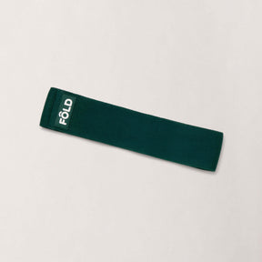 Pilates Resistance Band - Forest Green Heavy displayed on a neutral background, designed for advanced Pilates workouts.