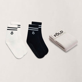 Crew Pilates Grip Socks and Resistance Band Bundle – Essentials featuring white and black grip socks with resistance band.