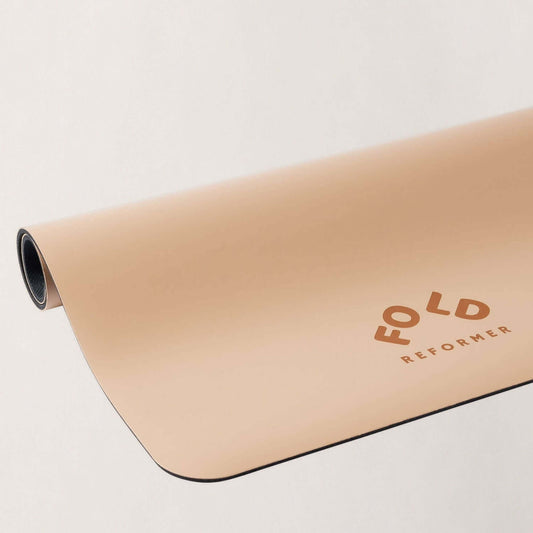 FOLD Essentials Reformer Pilates Mat - Almond with plush cushioning for optimal comfort during workouts.