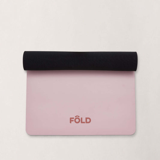 FOLD Reformer Pilates Mat - Pink with black rolled edge, perfect for comfortable pilates workouts.