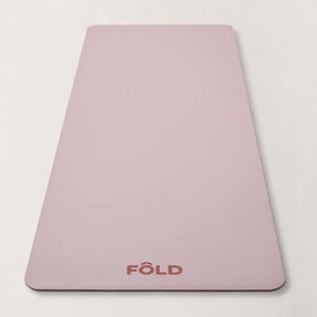 FOLD Yoga Mat - Pink, featuring a safe grip surface for yoga and Pilates workouts.