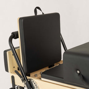 FÔLD Jumpboard on a FÔLD Reformer with Black upholstery