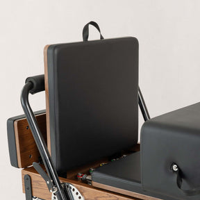 FÔLD Jumpboard on a FÔLD Reformer with Black upholstery