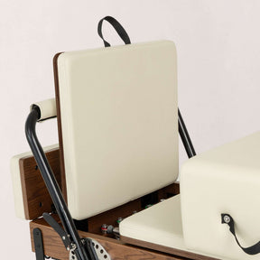 FÔLD Jumpboard on a FÔLD Reformer with Vanilla upholstery