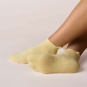 Pilates Low Rise Grip Socks - Butter Yellow, showcasing soft yellow grip socks designed for optimal performance and comfort.