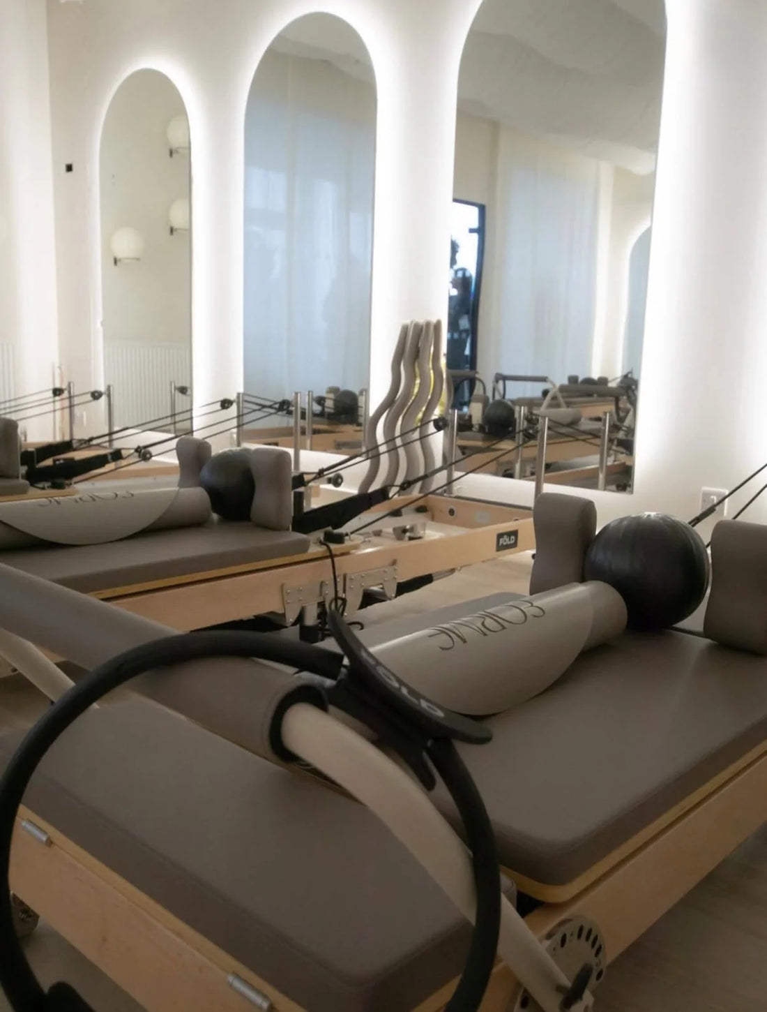 10 Best Reformer Pilates Classes in Manchester - interior of a modern reformer Pilates studio.