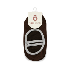 Brown grip sock with a white label on a white background