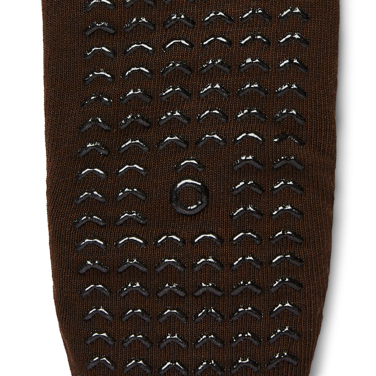 Brown sock with black textured pattern on a white background
