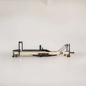 Pilates reformer on a white background