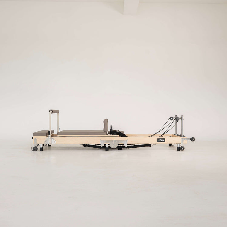 Pilates reformer on a white background