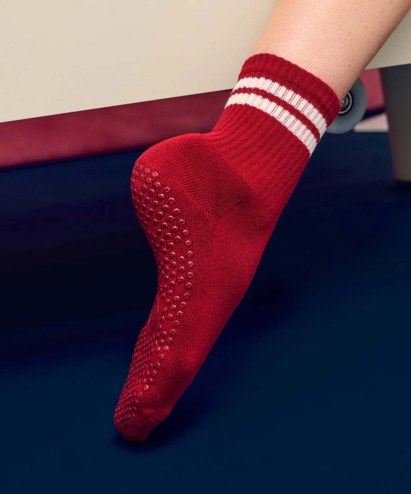 Red MoveActive Crew Grip Socks in Crimson Dream offer organic cotton comfort and versatility with a relaxed fit and durable grip design.