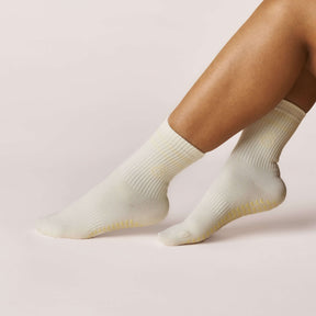 Everyday Crew Grip Socks - Butter Yellow showcased on model foot, featuring soft cotton, yellow non-slip soles.