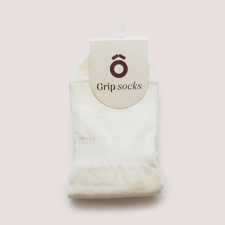 Everyday Crew Grip Socks - Butter Yellow displayed in a soft cotton design with a tag for grip socks.