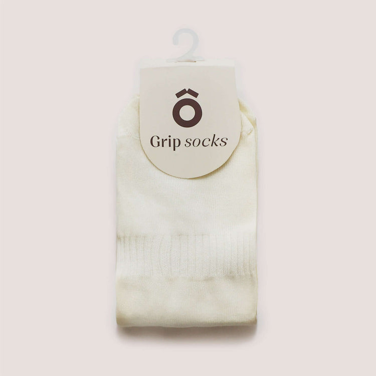Everyday Crew Grip Socks - Forest Green displayed with a label on cream-colored background.