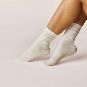 Everyday Crew Grip Socks - Grey displayed on feet, featuring soft cotton and non-slip soles for comfort and stability.