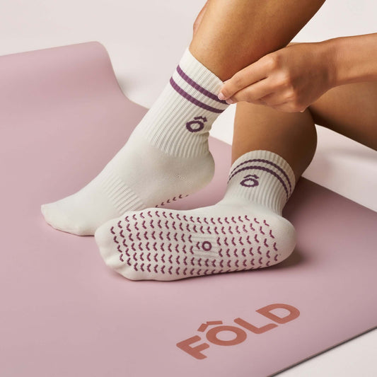 Everyday Crew Grip Socks - Magenta worn on feet with non-slip soles, on a pink exercise mat.