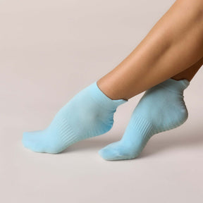 Pilates Low Rise Grip Socks - Baby Blue showcased on a foot, highlighting the soft cotton blend and low-rise design.