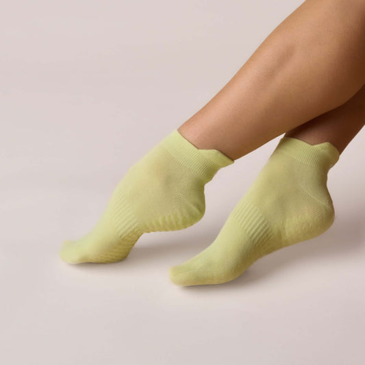 Pilates Low Rise Grip Socks - Lime shown on feet, featuring a soft breathable cotton blend for comfort and support.