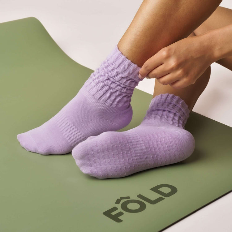 Pilates Scrunch Grip Socks - Lilac shown on a yoga mat, featuring non-slip, soft cotton with scrunched design.