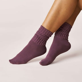Pilates Scrunch Grip Socks - Magenta displayed on a model's feet showcasing the scrunch design and snug fit.